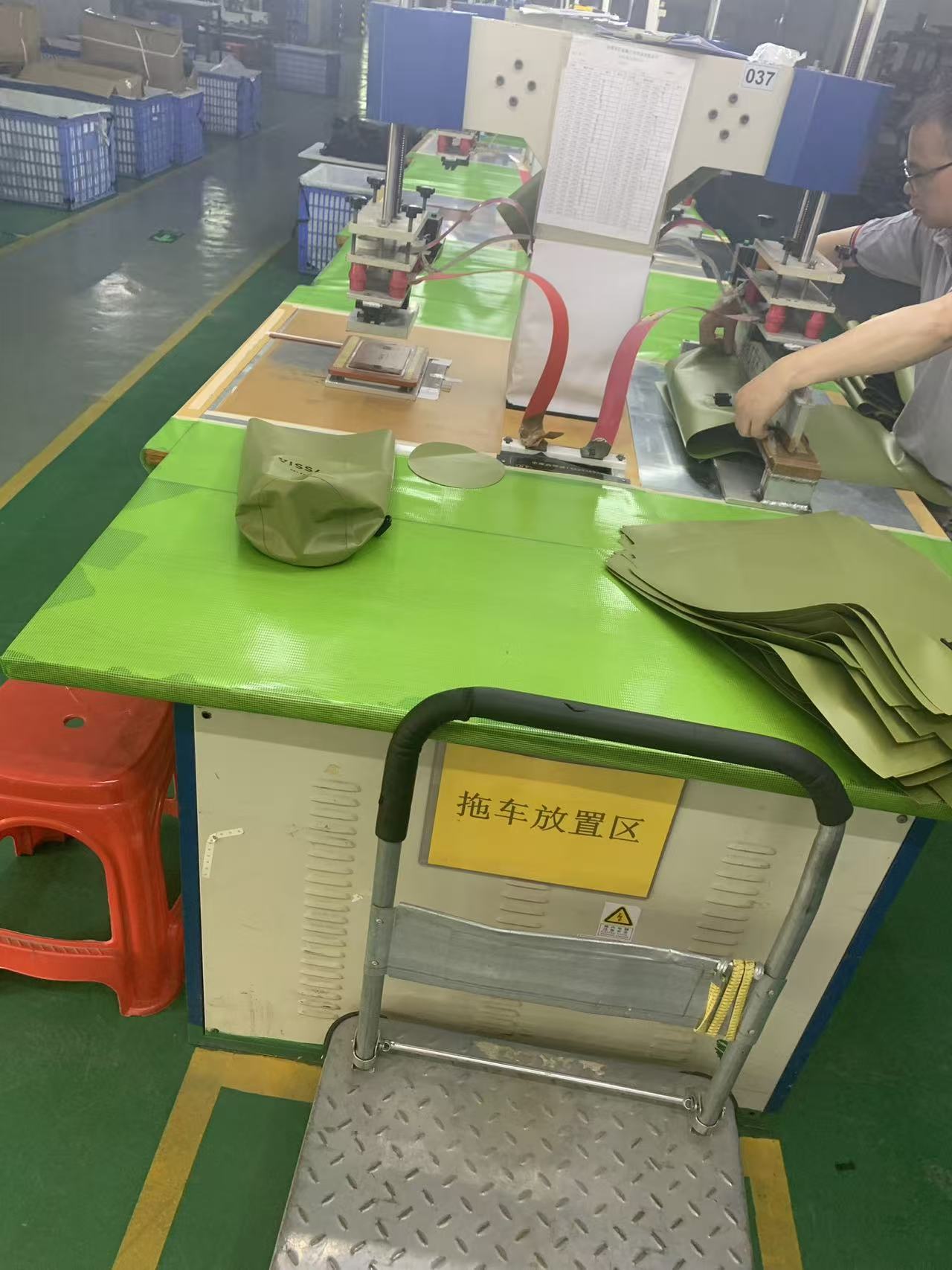 Professional high-frequency welding station at Sealock, showcasing the precision tooling used for waterproof gear.